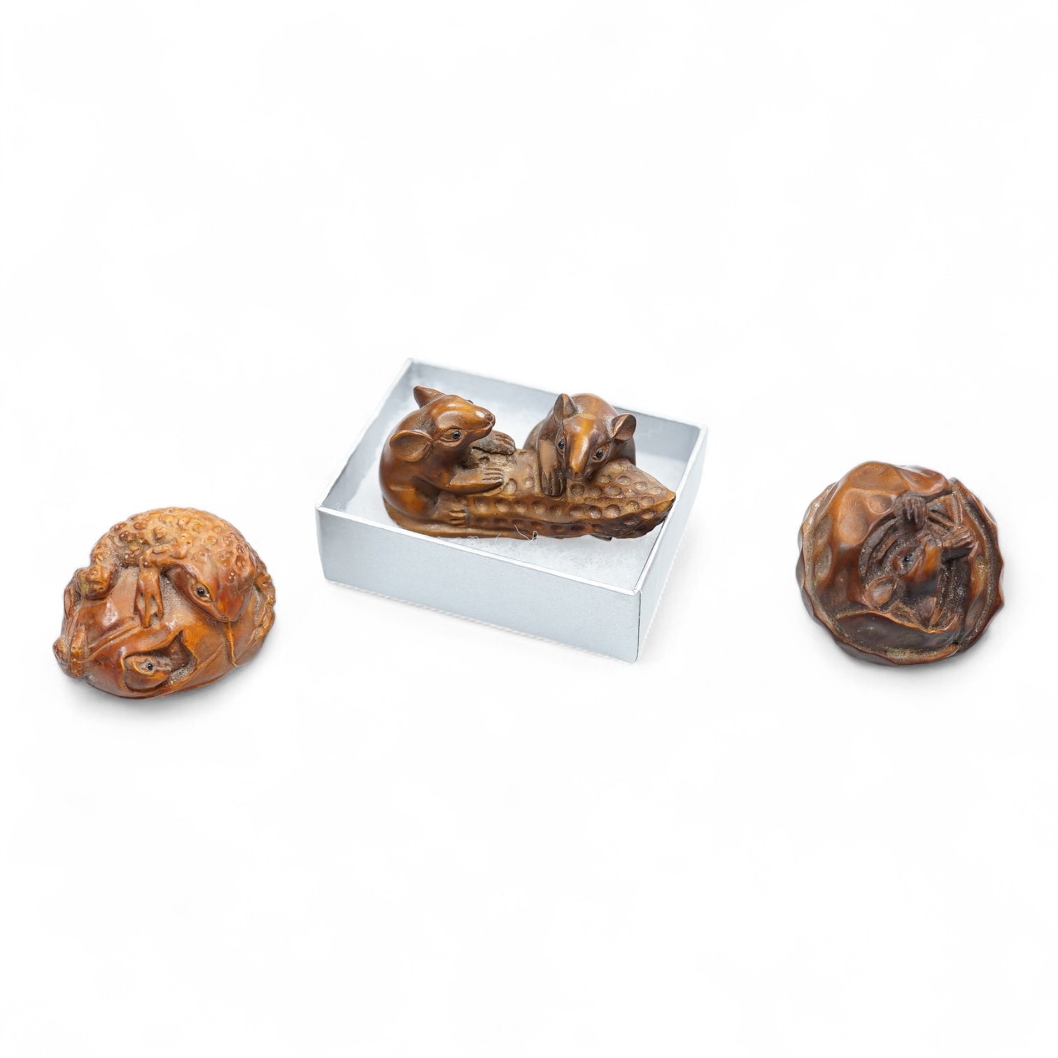 Three carved hardwood netsuke, signed